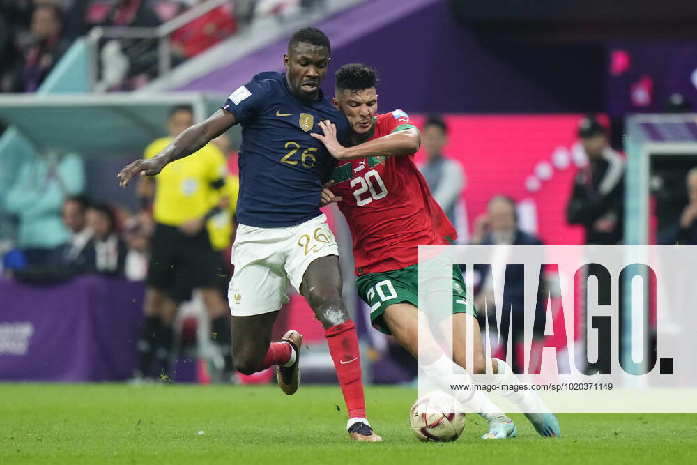 France v Morocco: Semi Final - FIFA World Cup, WM, Weltmeisterschaft, Fussball Qatar 2022 Benjamin Pavard right-back of France and Bayern Munich 6 and Achraf Dari centre-back of Morocco and Stade Brestois compete for the ball during the FIFA World Cup Qatar 2022 semi final match between France and Morocco at Al Bayt Stadium on December 14, 2022 in Al Khor, Qatar. Al Khor Qatar