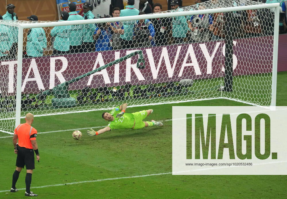(221218) -- LUSAIER, Dec. 18, 2022 -- Emiliano Martinez, goalkeeper of Argentina, makes a save of the penalty from Aurelien Tchouameni of France during the penalty shootout of the Final between Argentina and France at the 2022 FIFA World Cup, WM, Weltmeisterschaft, Fussball at Lusail Stadium in Lusail, Qatar, Dec. 18, 2022. ) (SP)QATAR-LUSAIL-2022 WORLD CUP-FINAL-ARG VS FRA XiaoxYijiu
