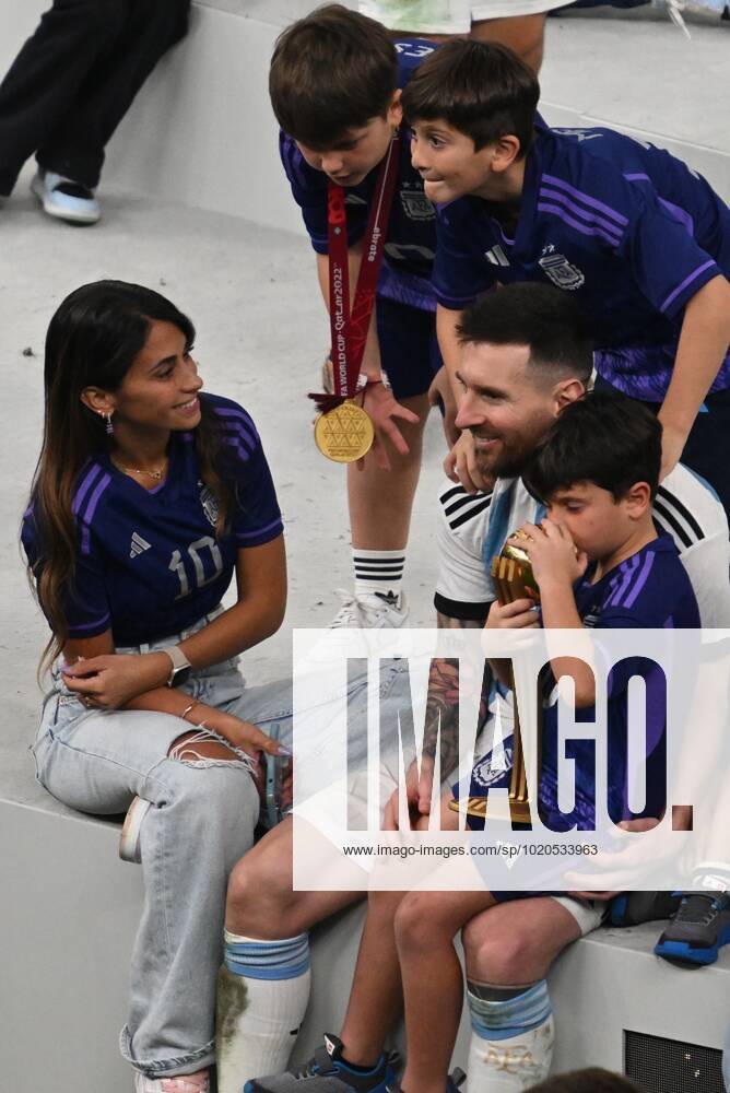 Qatar Soccer World Cup Argentina - France 8342474 18.12.2022 Argentina s Lionel Messi celebrates the team s victory with his family after the trophy ceremony following the Qatar 2022 World Cup final match between Argentina and France at the Lusail Iconic Stadium, in Lusail, Qatar. Grigory Sysoev Sputnik Lusail Qatar