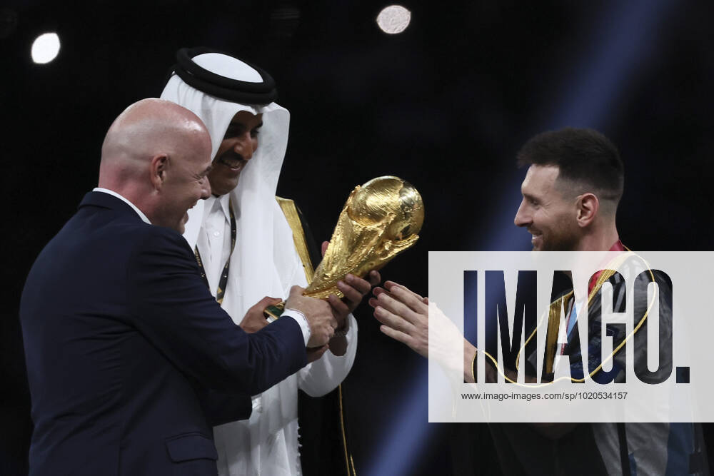 (221218) -- LUSAIL, Dec. 18, 2022 -- FIFA President Gianni Infantino (L) and The Emir of Qatar Sheikh Tamim bin Hamad Al Thani (C) award Lionel Messi of Argentina during the awarding ceremony of the 2022 FIFA World Cup, WM, Weltmeisterschaft, Fussball at Lusail Stadium in Lusail, Qatar, Dec. 18, 2022. ) (SP)QATAR-LUSAIL-2022 WORLD CUP-FINAL-ARG VS FRA LanxHongguang