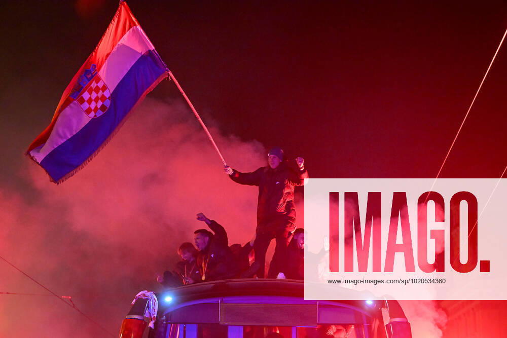 Croatia victory parade Domagoj Vida of Croatia waves with Croatia flag during the Croatia team victory parade at Ban Jelacic square (following their victory over Morocco in the 2022 FIFA World Cup, WM, Weltmeisterschaft, Fussball bronze medal match the previous day) on December 18, 2022 in Zagreb, Croatia. MarkoxLukunic PIXSELL