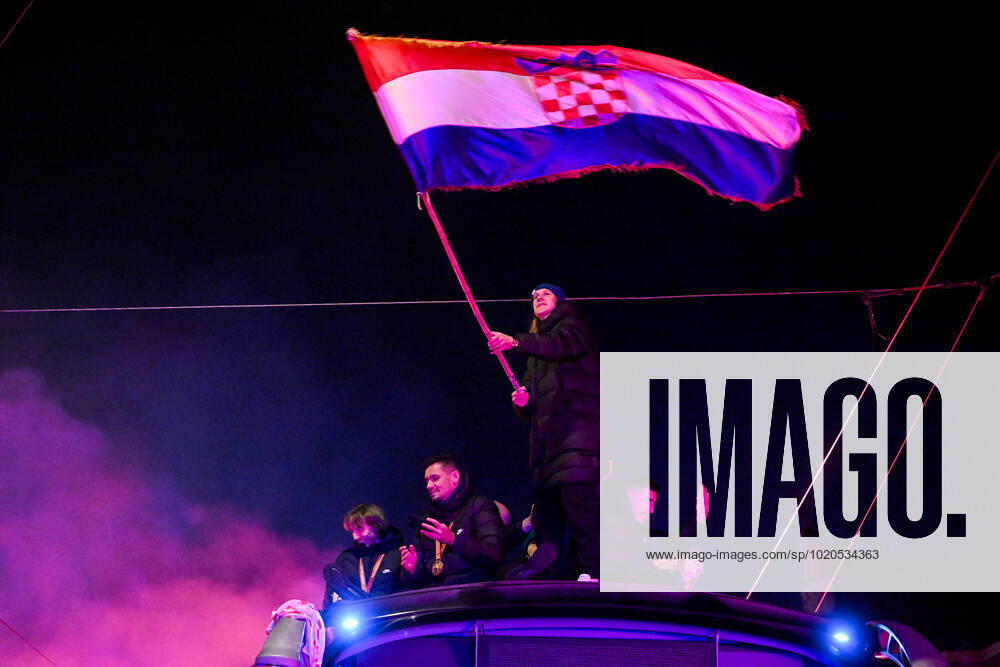 Croatia victory parade Domagoj Vida of Croatia waves with Croatia flag during the Croatia team victory parade at Ban Jelacic square (following their victory over Morocco in the 2022 FIFA World Cup, WM, Weltmeisterschaft, Fussball bronze medal match the previous day) on December 18, 2022 in Zagreb, Croatia. MarkoxLukunic PIXSELL