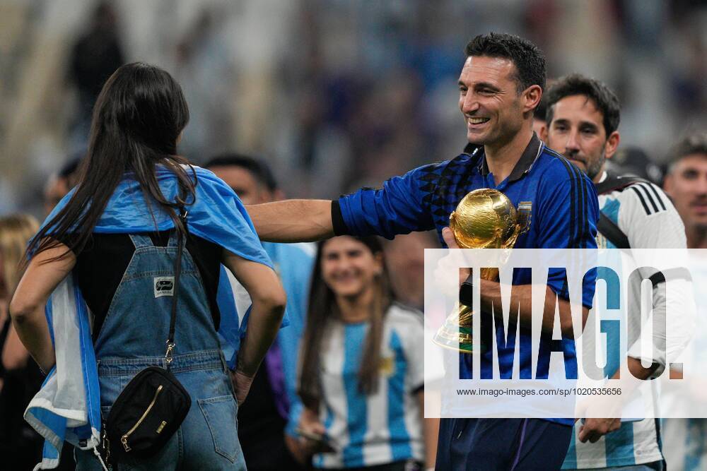 Mandatory Credit: Photo by Dave Shopland Shutterstock (13670813en) Argentina Manager Lionel Scaloni hugs the FIFA World Cup, WM, Weltmeisterschaft, Fussball trophy and his wife Elisa Montero Argentina v France, FIFA World Cup 2022, Final, Football, Lusail Stadium, Al Daayen, Qatar - 18 Dec 2022 Editorial Use Only Argentina v France, FIFA World Cup 2022, Final, Football, Lusail Stadium, Al Daayen, Qatar - 18 Dec 2022 Editorial Use Only