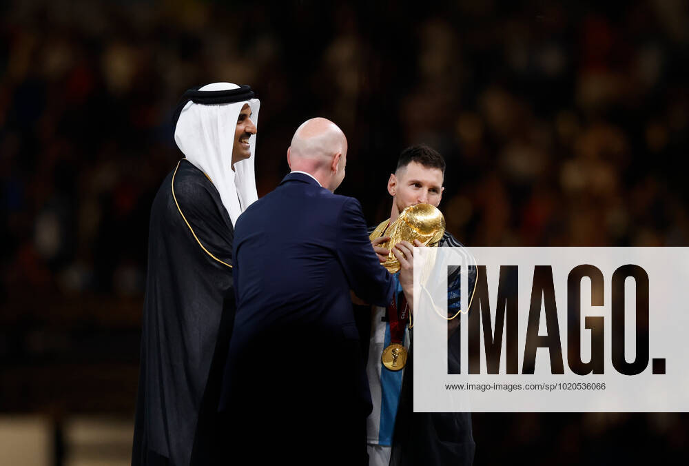 (221218) -- LUSAIL, Dec. 18, 2022 -- FIFA President Gianni Infantino (C) and The Emir of Qatar Sheikh Tamim bin Hamad Al Thani (L) award Lionel Messi of Argentina during the awarding ceremony of the 2022 FIFA World Cup, WM, Weltmeisterschaft, Fussball at Lusail Stadium in Lusail, Qatar, Dec. 18, 2022. ) (SP)QATAR-LUSAIL-2022 WORLD CUP-FINAL-ARG VS FRA WangxLili