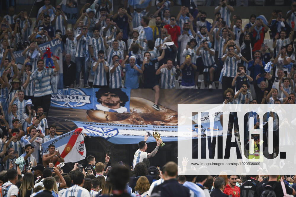 (221218) -- LUSAIER, Dec. 18, 2022 -- Lionel Messi of Argentina celebrates with the trophy in front of the fans after winning the Final between Argentina and France at the 2022 FIFA World Cup, WM, Weltmeisterschaft, Fussball at Lusail Stadium in Lusail, Qatar, Dec. 18, 2022. ) (SP)QATAR-LUSAIL-2022 WORLD CUP-FINAL-ARG VS FRA LixGa