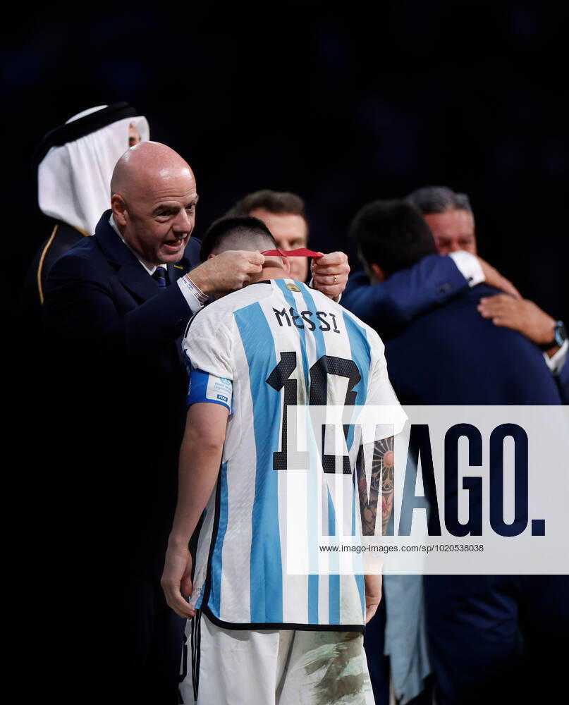 (221218) -- LUSAIL, Dec. 18, 2022 -- FIFA President Gianni Infantino (L) awards Lionel Messi of Argentina during the awarding ceremony of the 2022 FIFA World Cup, WM, Weltmeisterschaft, Fussball at Lusail Stadium in Lusail, Qatar, Dec. 18, 2022. ) (SP)QATAR-LUSAIL-2022 WORLD CUP-FINAL-ARG VS FRA WangxLili