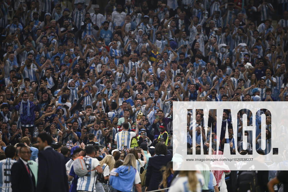 (221218) -- LUSAIER, Dec. 18, 2022 -- Lionel Messi of Argentina celebrates with the trophy in front of the fans after winning the Final between Argentina and France at the 2022 FIFA World Cup, WM, Weltmeisterschaft, Fussball at Lusail Stadium in Lusail, Qatar, Dec. 18, 2022. ) (SP)QATAR-LUSAIL-2022 WORLD CUP-FINAL-ARG VS FRA LixGa