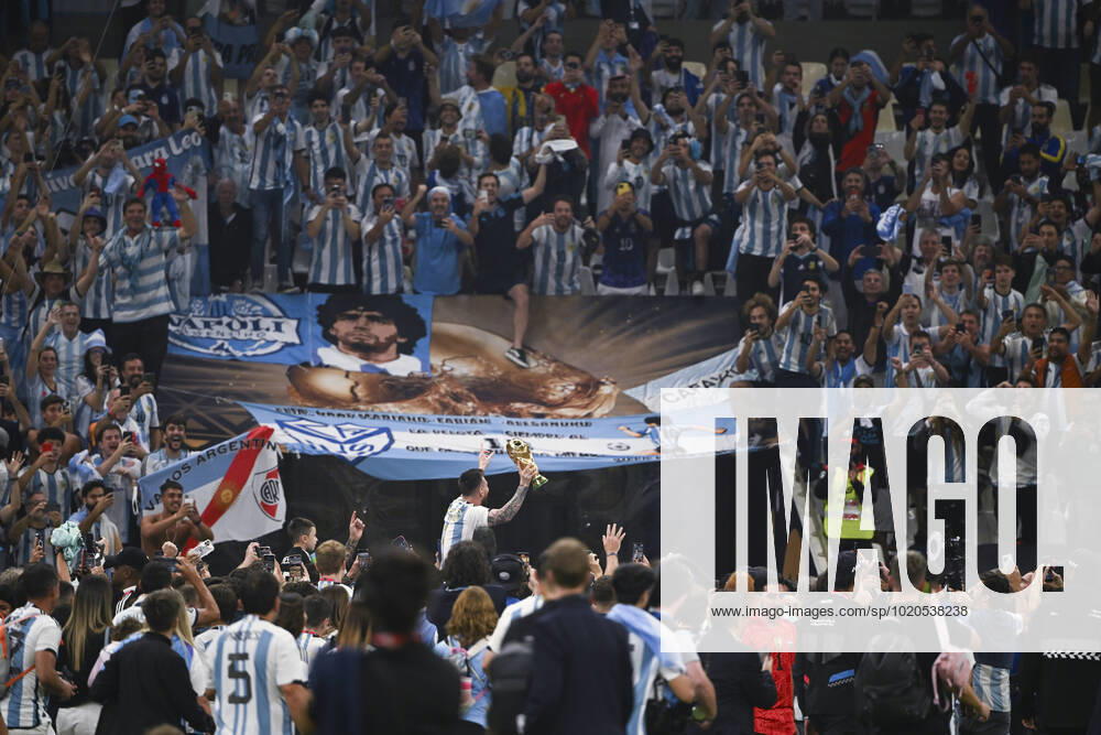 (221218) -- LUSAIER, Dec. 18, 2022 -- Lionel Messi of Argentina celebrates with the trophy in front of the fans after winning the Final between Argentina and France at the 2022 FIFA World Cup, WM, Weltmeisterschaft, Fussball at Lusail Stadium in Lusail, Qatar, Dec. 18, 2022. ) (SP)QATAR-LUSAIL-2022 WORLD CUP-FINAL-ARG VS FRA LixGa