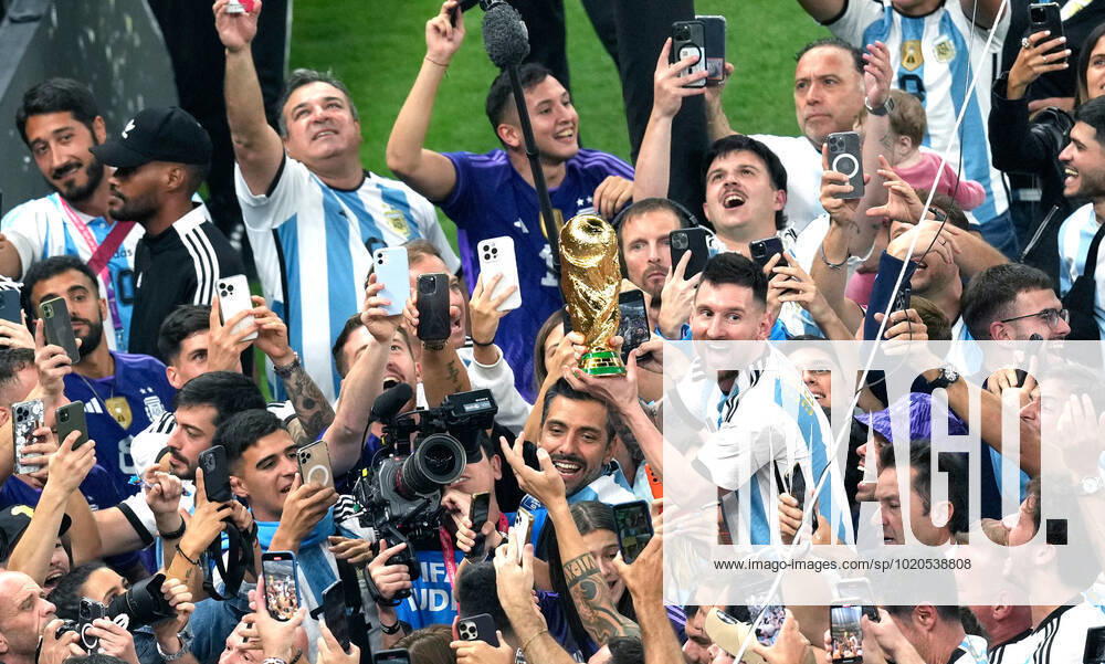 (221218) -- LUSAIL, Dec. 18, 2022 -- Lionel Messi of Argentina celebrates with the World Cup Trophy after the awarding ceremony of the 2022 FIFA World Cup, WM, Weltmeisterschaft, Fussball at Lusail Stadium in Lusail, Qatar, Dec. 18, 2022. ) (SP)QATAR-LUSAIL-2022 WORLD CUP-FINAL-ARG VS FRA PanxYulong
