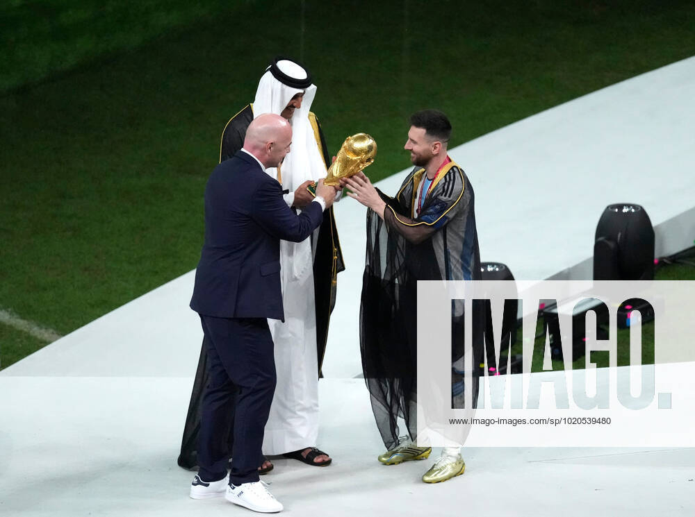 (221219) -- LUSAIL, Dec. 18, 2022 -- FIFA President Gianni Infantino (L) and the Emir of Qatar Sheikh Tamim bin Hamad Al Thani (C) award Lionel Messi of Argentina during the 2022 FIFA World Cup, WM, Weltmeisterschaft, Fussball at Lusail Stadium in Lusail, Qatar, Dec. 18, 2022. ) (SP)QATAR-LUSAIL-2022 WORLD CUP-FINAL-ARG VS FRA PanxYulong