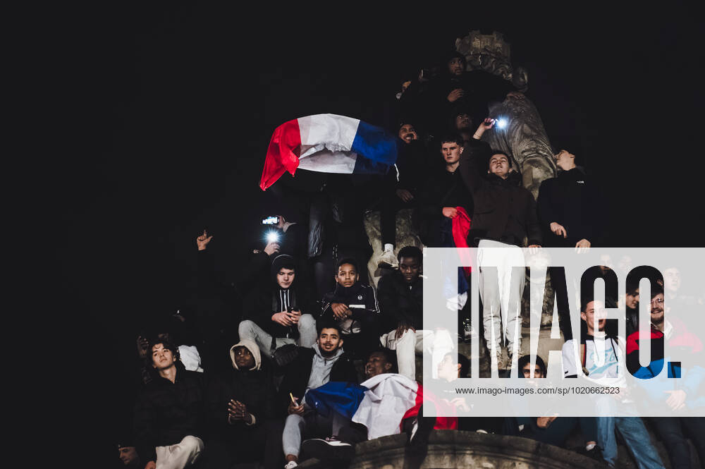 French Football Team Fans Greet The Players On The Place De La Concorde In Paris French football team supporters gather on the Place de la Concorde with French flags to welcome the players on the balcony of the Hotel de Crillon after their return from Qatar after their defeat against Argentina in the World Cup final in Paris on December 19, 2022. Paris France