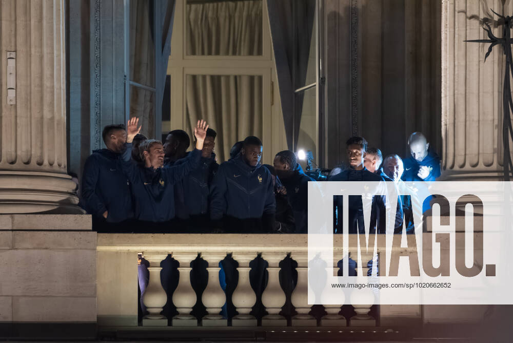 French Football Team Fans Greet The Players On The Place De La Concorde In Paris French football team players including Aurelien Tchouameni, Antoine Griezman, Kingsley Coman and Olivier Giroud wave to the crowd as French football team supporters gather on the Place de la Concorde with French flags to welcome the players on the balcony of the Hotel de Crillon after their return from Qatar following their defeat by Argentina in the World Cup final in Paris on December 19, 2022. Paris France