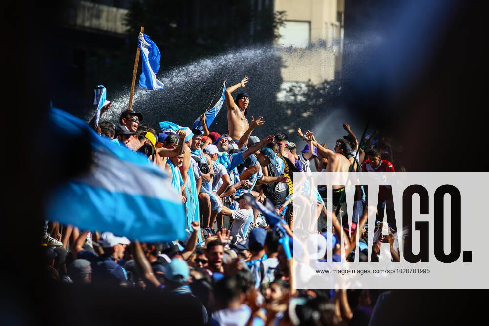 Argentinian fans seen during the celebrations in the Plaza de Mayo. More than 4 million people invaded the city of Buenos Aires to celebrate the world cup obtained by the Argentine Soccer Team in the FIFA World Cup, WM, Weltmeisterschaft, Fussball Qatar 2022. Buenos Aires Argentina - ZUMAs197 0197027103st