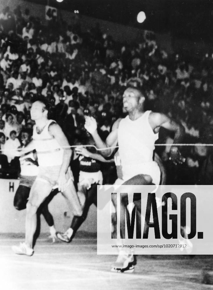 PALUPI Jim Hines of Houston (right) crosses the finish line in a 100 metres semi-final in world record time of 9.9 seconds. Second is Ronnie Ray Smith. AZU Track and Field Championships , Sacramento , California 21st June 1968 United States