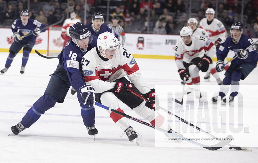 Switzerland s Miles Muller gets around Finland s Vemer Miettinen during first period IIHF World Junior Hockey Championship hockey action in Moncton, N.B., on Monday, Dec. 26, 2022. Canada News - December 26, 2022 - ZUMAc35_ 20221226_zaf_c35_009