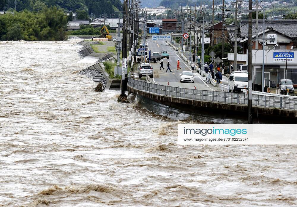 Torrential rain in central Japan Photo taken July 8, 2020, shows the swollen Hida River in Gero in Gifu Prefecture as torrential rain lashes central Japan.