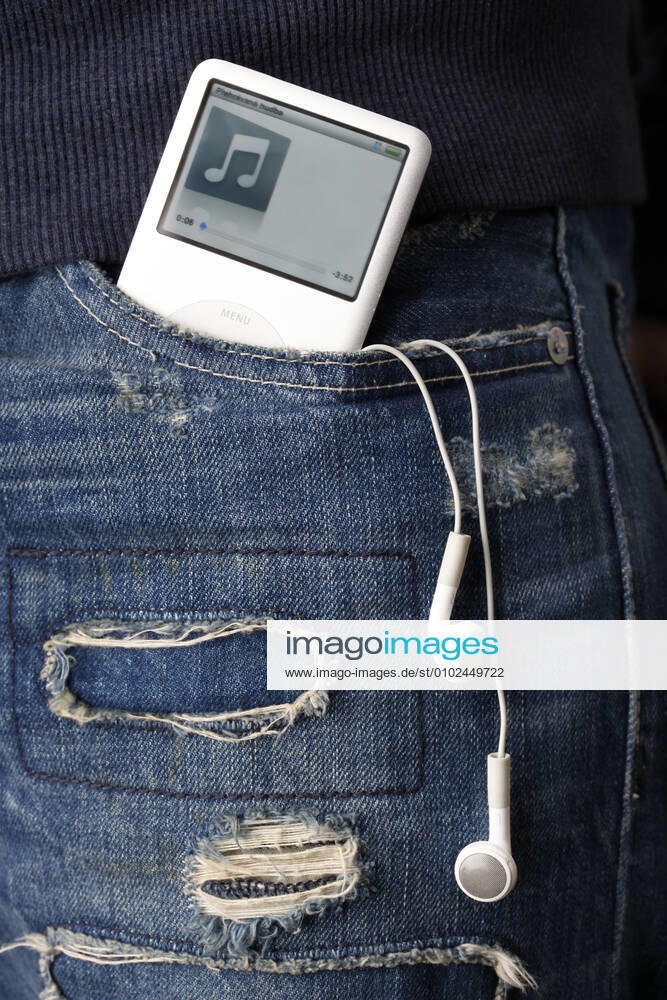 An Apple iPod with headphones sticking out of teenager s pocket, fashion, in ripped up jeans. (CTKxPhoto JosefxHorazny) CTKPhotoF200903040133401