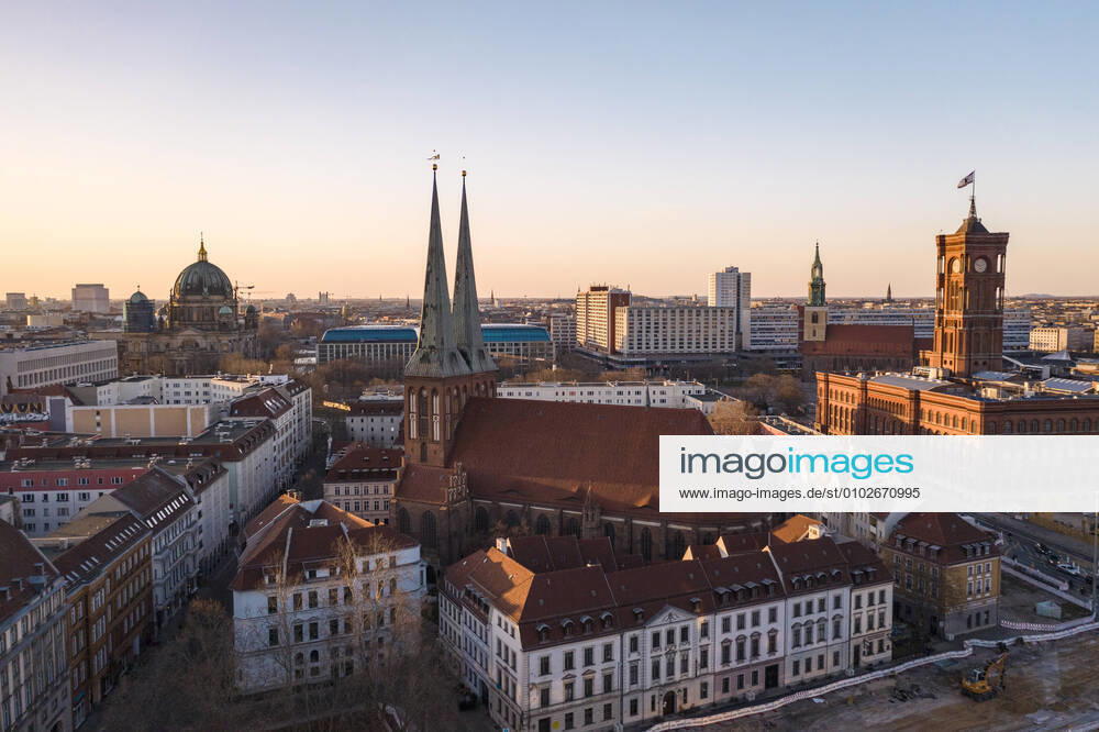 Germany, Berlin, Aerial view of Saint Nicholas Church and surrounding buildings at dusk TAMF02415