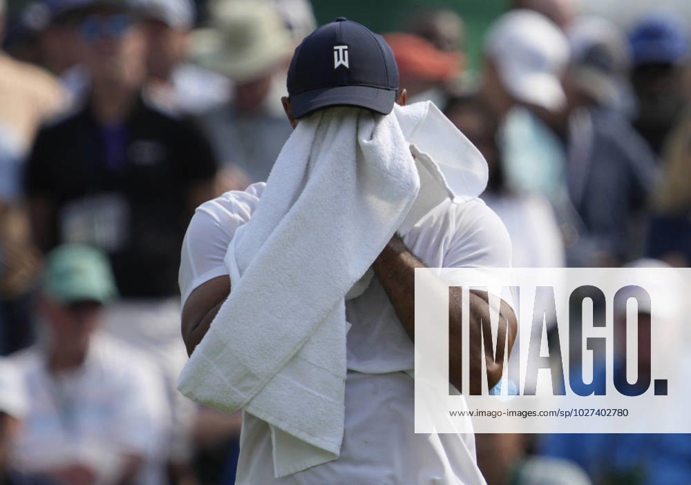 Tiger Woods wipes off on the green of the second hole during the first round at the Masters tournament at Augusta National Golf Club in Augusta, Georgia on Thursday, April 6, 2023. AUG20230406205 JOHNxANGELILLO