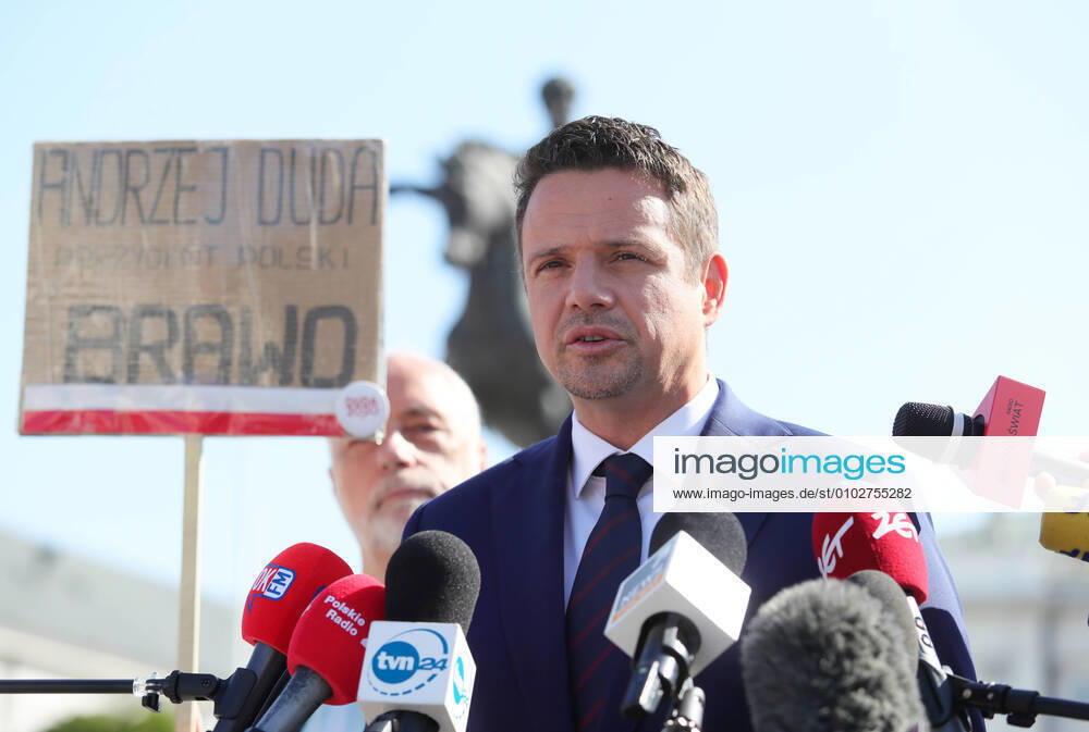 KW31 Rafal Trzaskowski holds a press briefing before the meeting with Poland s president Andrzej Duda Rafal Trzaskowski holds a press briefing before the meeting with Poland s president Andrzej Duda on July 30, 2002 in Warsaw, Poland. Rafal Trzaskowski s opponent holds a poster that reads: Andrzej Duda. President of Poland. Bravo. EN_01439234_0009