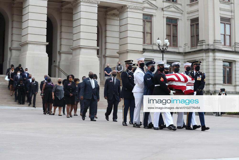 An honor guard, followed by members of Georgia s Black Caucus, carries the casket of Rep. John Lewis from the Capitol on July 30, 2020 in Atlanta, Georgia. On the sixth day of the Celebration of Life for Rep. John Lewis, after traveling via motorcade from the Georgia state Capitol where he was lying in state overnight, his funeral is to be held at Ebeneezer Baptist Church in Atlanta, with burial to follow. Atlanta USA - ZUMAm67_ 20200412_zaf_m67_055