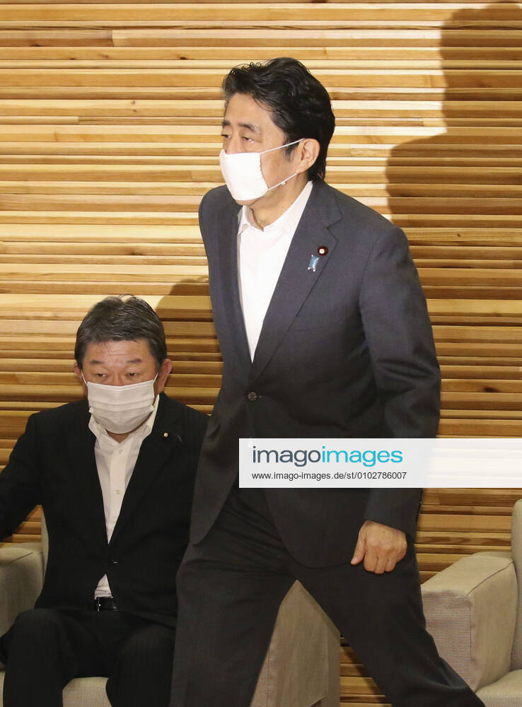 Japan PM Abe Japanese Prime Minister Shinzo Abe attends a Cabinet meeting at his office in Tokyo on July 31, 2020. Seen on the left is Foreign Minister Toshimitsu Motegi.