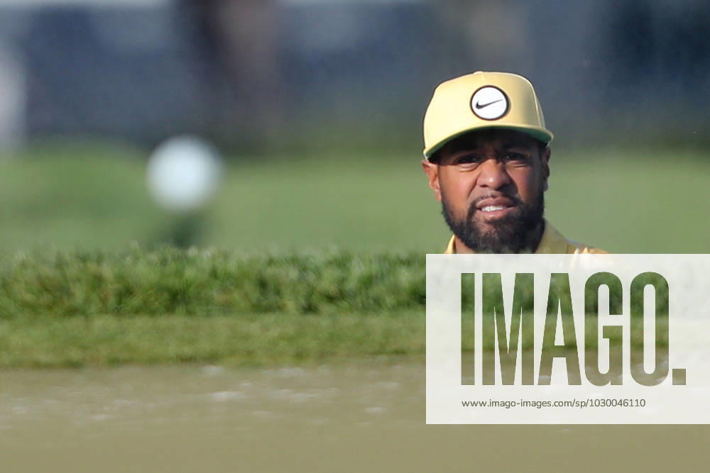 Tony Finau watches his bunker shot bounce onto the 9th green during the first round of the 2023 PGA, Golf Herren Championship at Oakwood Country Club in Rochester,New York on Thursday, May 18, 2023. PGA20230518128 AARONxJOSEFCZYK