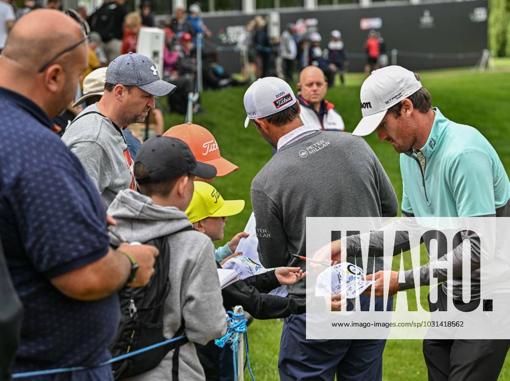 2nd July 2023; The Belfry, Sutton Coldfield, West Midlands, England: Betfred British Masters Golf, Day 4; Andrew Wilson and Edoardo Molinari sign autographs for fans by the 18th green ActionPlus12526241 GodfreyxPitt
