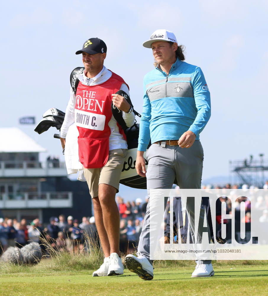 Last year s Open winner Australian Cameron Smith walks with his caddie on the second fairway on the first day at the 151st Open Championship at the Royal Liverpool Golf Club in Hoylake England on Thursday, July 20, 2023. LON2023072015 HUGOxPHILPOTT