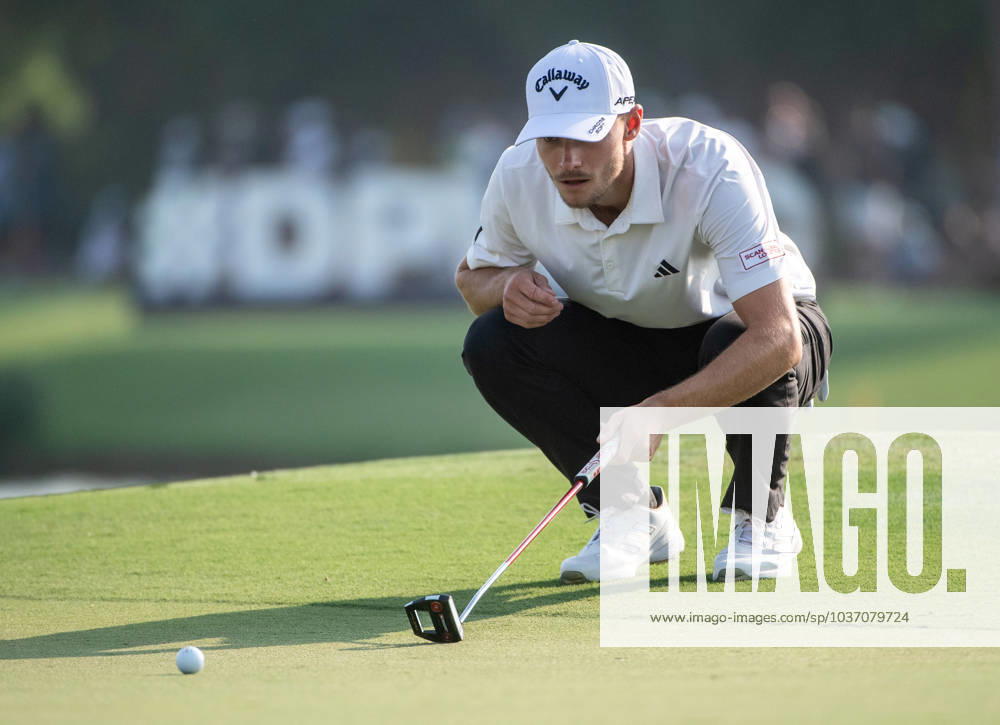 NICOLAI HoJGAARD of Denmark checks the 17th green during DP World Tour Championship in Dubai, United Arab Emirates, Nov 19, 2023. Dubai United Arab Emirates