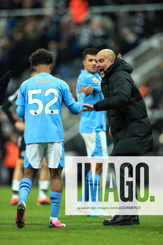 Football - Premier League - Newcastle United v Manchester City 13th January 2024 - Premier League - Newcastle United v Manchester City - Manchester City manager Pep Guardiola celebrates with winning goal scorer Oscar Bobb - Photo: Simon Stacpoole Offside. Newcastle-upon-Tyne UK