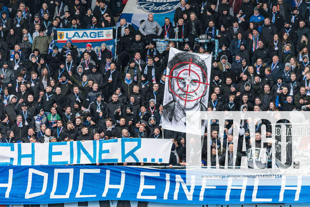 Rostock, Deutschland 17. Februar 2024: 2. BL - 2023 2024 - FC Hansa Rostock vs. Hamburger SV Im Bild: Banner auf der Südtribüne nur noch einer mit einem Porträt eines Bildes von einem potentiellen DFL Investor CVC im Fadenkreuz DFL regulations prohibit any use of photographs as image sequences and or quasi-video.