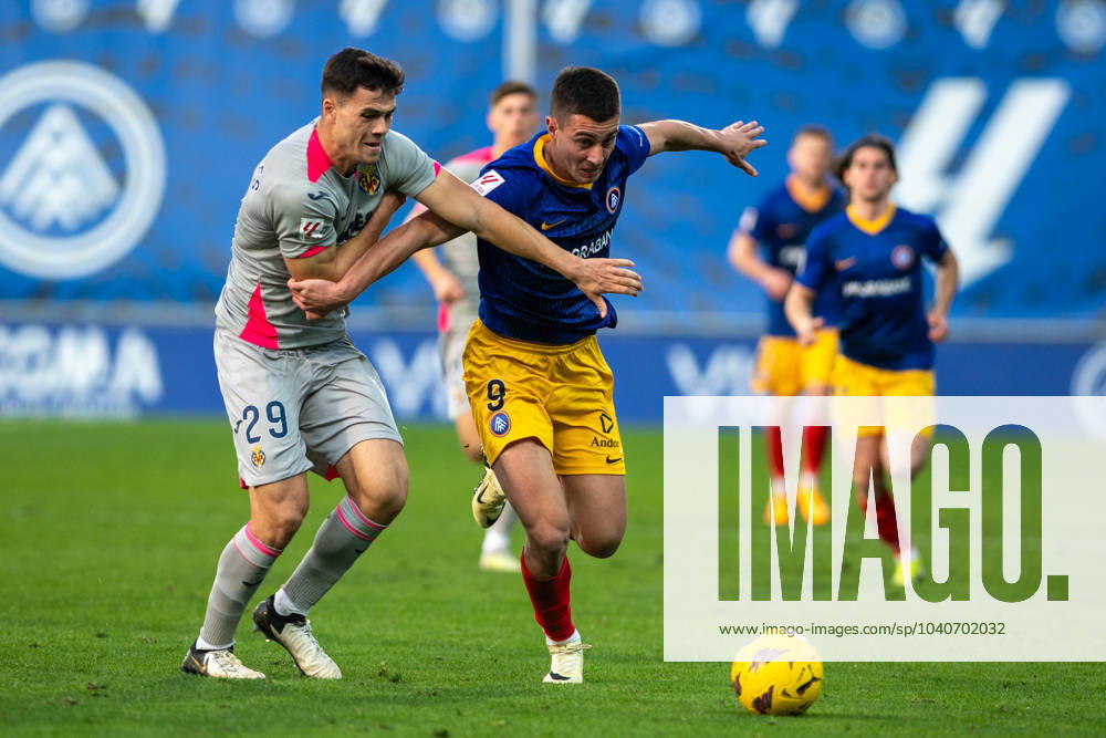 FC Andorra v Villareal B - Segunda Division Jon Karrikaburu of FC Andorra and Antonio Espigares of Villareal B CF are in action during the LaLiga Hypermotion 2023 - 2024 match between FC Andorra and Villareal B CF at Estadi Nacional d Andorra in Andorra La Vella, Andorra, on February 17, 2023. Andorra la Vella Andorra