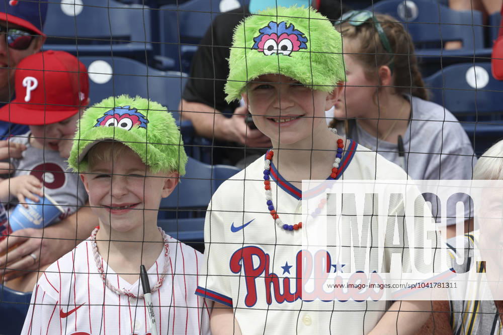 Two young Philadelphia Phillies fans with their Fanaticâ€⠢s hats enjoy the day during an MLB, Baseball Herren, USA spring training game against the Miami Marlins on March 1, 2024 at BayCare Ballpark. The Phillies and Marlins played to a 6-6 tie. Clearwater USA - ZUMAh180 20240301_zsp_h180_001