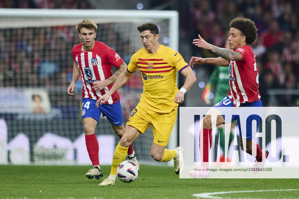 LaLiga EA Sports, Atletico de Madrid v FC Barcelona, Barca MADRID, SPAIN - MARCH 17: Robert Lewandowski Centre-Forward of FC Barcelona competes for the ball with Axel Witsel Centre-Back of Atletico de Madrid during the LaLiga EA Sports match between Club Atletico de Madrid and FC Barcelona at Civitas Metropolitano Stadium on March 17, 2024 in Madrid, Spain. (Photo By Francisco Macia Photo Players Images) Madrid Civitas Metropolitano Stadium Madrid Spain