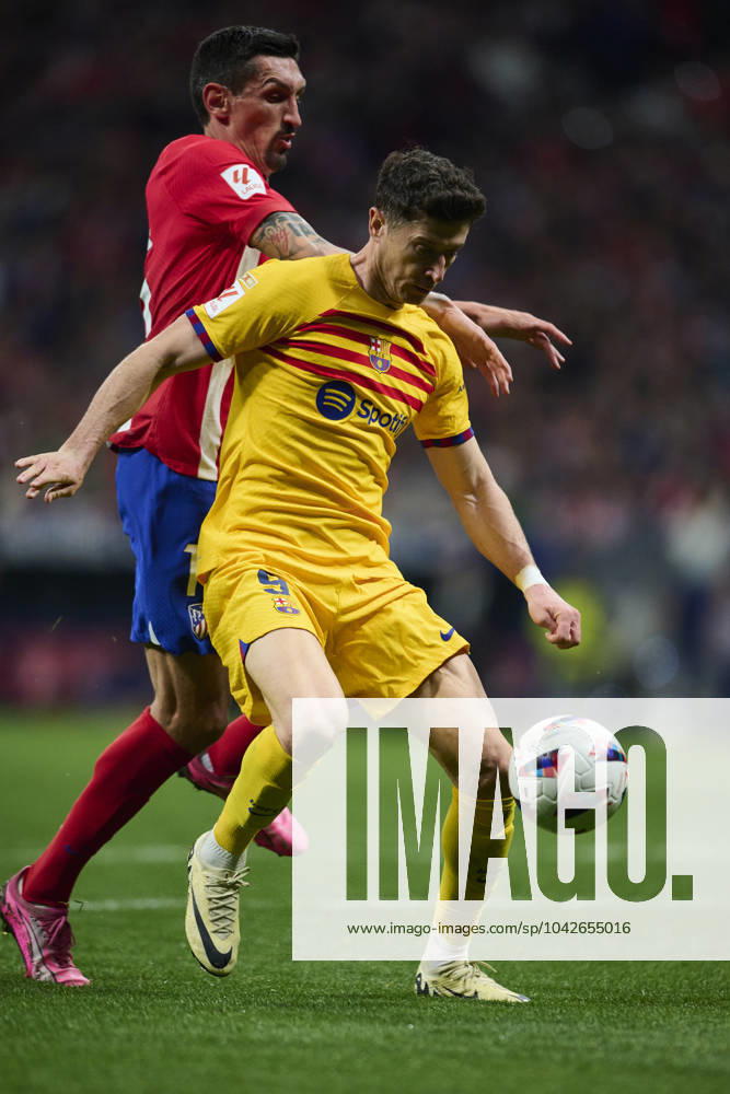 LaLiga EA Sports, Atletico de Madrid v FC Barcelona, Barca MADRID, SPAIN - MARCH 17: Robert Lewandowski Centre-Forward of FC Barcelona competes for the ball with Stefan Savic Centre-Back of Atletico de Madrid during the LaLiga EA Sports match between Club Atletico de Madrid and FC Barcelona at Civitas Metropolitano Stadium on March 17, 2024 in Madrid, Spain. (Photo By Francisco Macia Photo Players Images) Madrid Civitas Metropolitano Stadium Madrid Spain