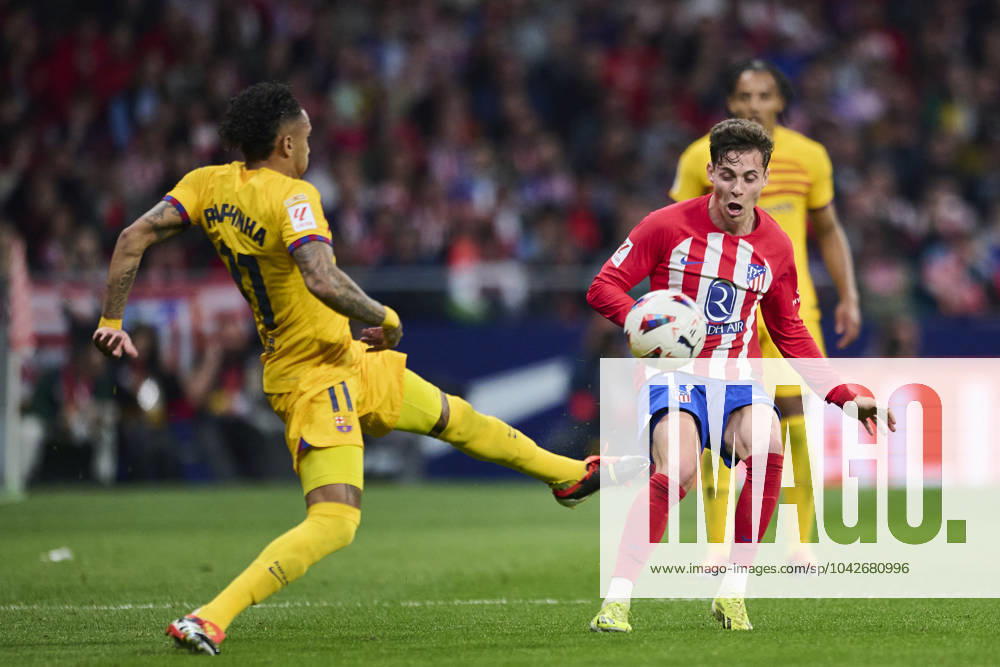 LaLiga EA Sports, Atletico de Madrid v FC Barcelona, Barca MADRID, SPAIN - MARCH 17: Raphael Dias Raphinha Right Winger of FC Barcelona competes for the ball with Rodrigo Riquelme Left Winger of Atletico de Madrid during the LaLiga EA Sports match between Club Atletico de Madrid and FC Barcelona at Civitas Metropolitano Stadium on March 17, 2024 in Madrid, Spain. (Photo By Francisco Macia Photo Players Images) Madrid Civitas Metropolitano Stadium Madrid Spain