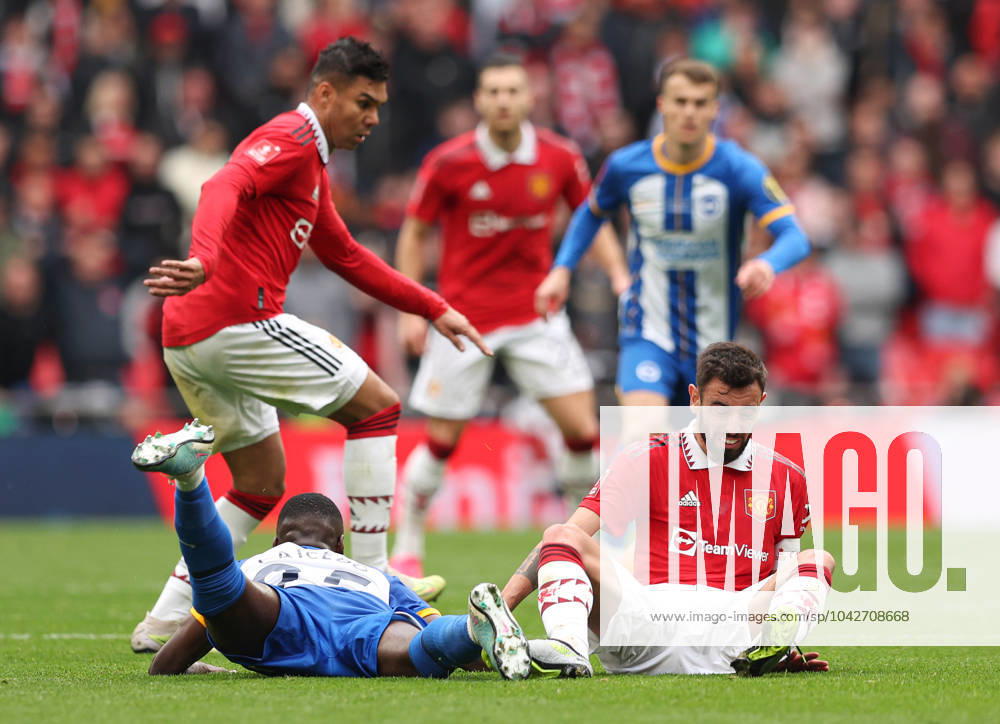 Brighton and Hove Albion v Manchester United, ManU - The FA Cup - Semi-Final - Wembley Stadium April 23, 2023, London: London, England, 23rd April 2023. Moises Caicedo of Brighton and Hove Albion and Bruno Fernandes of Manchester United on the floor after battling for the ball during the The FA Cup match at Wembley Stadium, London. London
