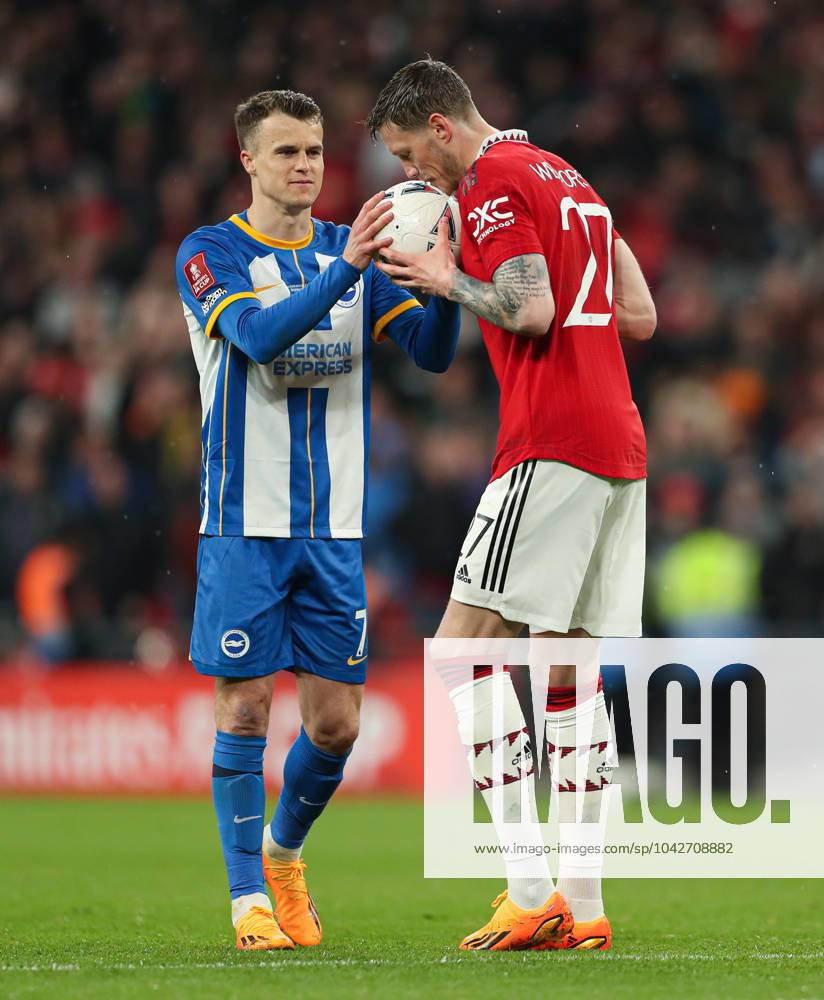 Brighton and Hove Albion v Manchester United, ManU - The FA Cup - Semi-Final - Wembley Stadium April 23, 2023, London: London, England, 23rd April 2023. Wout Weghorst of Manchester United (right) gives the ball to Solly March of Brighton and Hove Albion (left) before his missed penalty in the shootout during the The FA Cup match at Wembley Stadium, London. London