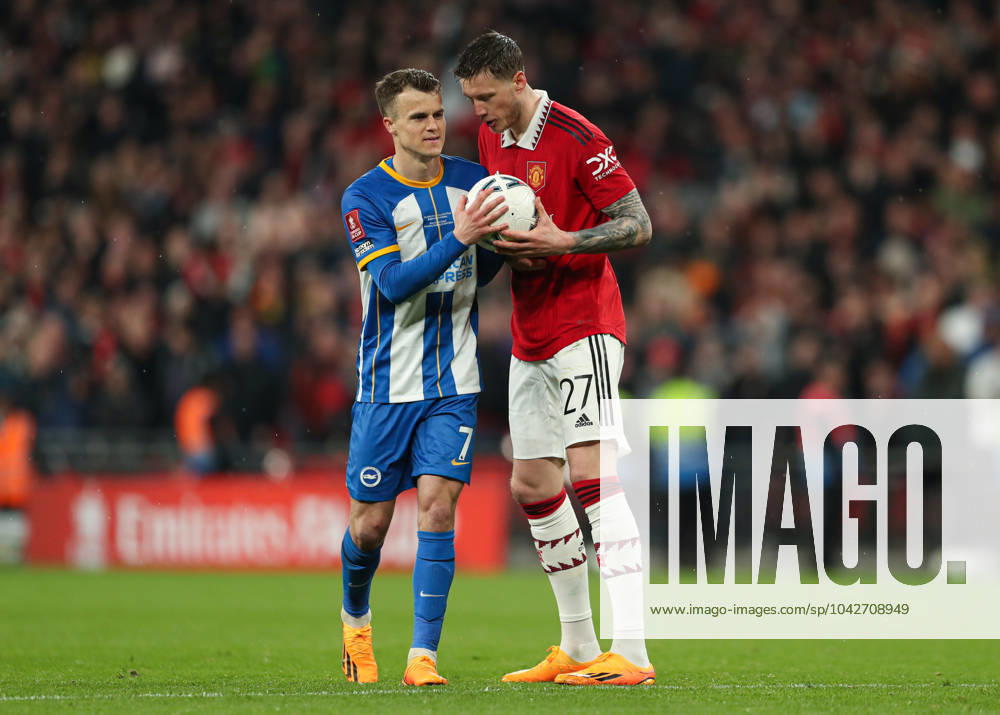 Brighton and Hove Albion v Manchester United, ManU - The FA Cup - Semi-Final - Wembley Stadium April 23, 2023, London: London, England, 23rd April 2023. Wout Weghorst of Manchester United (right) gives the ball to Solly March of Brighton and Hove Albion (left) before his missed penalty in the shootout during the The FA Cup match at Wembley Stadium, London. London