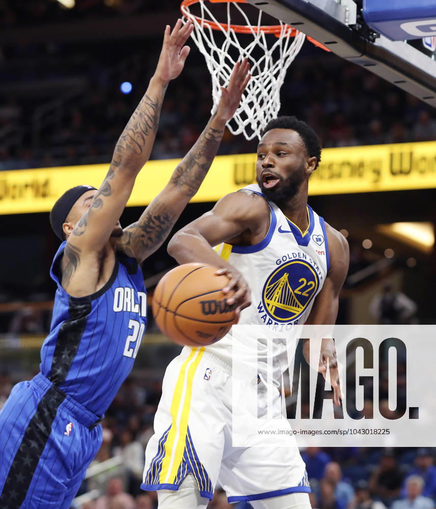 Orlando, FL - Florida, USA: The Golden State Warriors Andrew Wiggins, right, passes around the Orlando Magic s Markelle Fultz at the Kia Center on Wednesday, March 27, 2024, in Orlando, Florida. Orlando USA - ZUMAm67_ 0442592973st