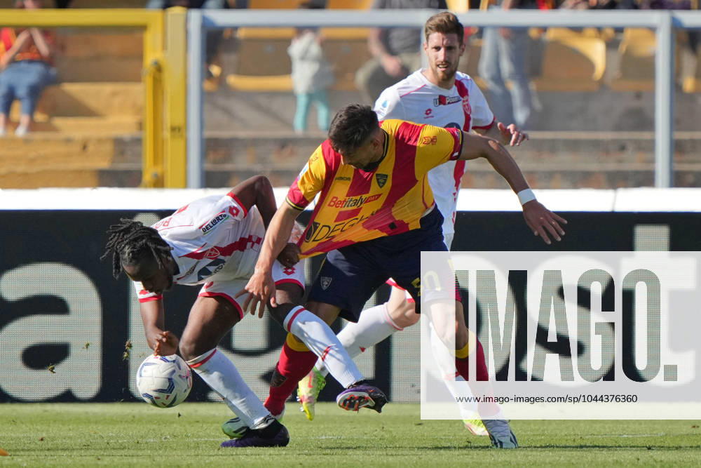 Jean-Daniel Akpa-Akpro of AC Monza in action against Santiago Pierotti of US Lecce during US Lecce vs AC Monza, Italian soccer Serie A match in Lecce, Italy, April 27 2024