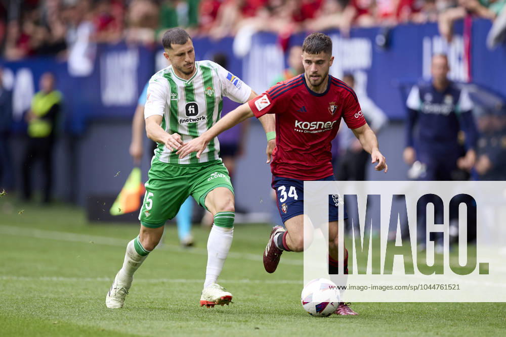 CA Osasuna v Real Betis Balompie - LaLiga EA Sports Guido Rodriguez of Real Betis Balompie competes for the ball with Iker Munoz of CA Osasuna during the LaLiga EA Sports match between CA Osasuna and Real Betis Balompie at El Sadar on May 5, 2024, in Pamplona, Spain. Pamplona El Sadar Navarra Spain RL_OSAvBET_00110