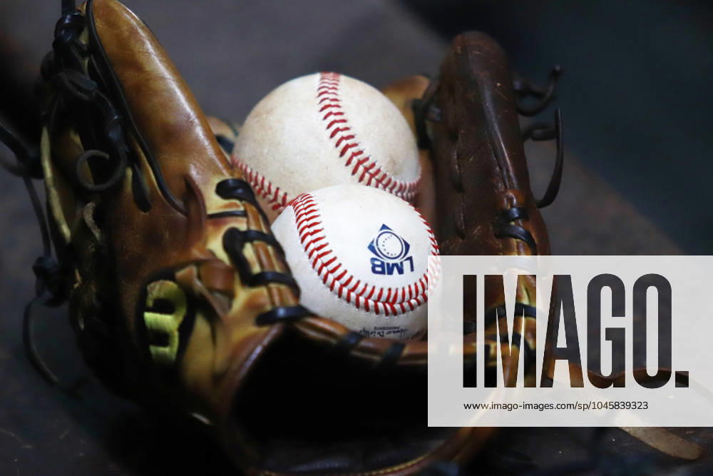 A baseball glove and baseballs are seen during the Mexican Baseball League (LMB) match 1 between Dorados de Chihuahua and Diablos Rojos del Mo xico , at Alfredo Harp Helu Stadium. Diablos Rojos defeat Dorados de Chihuahua 3-1. Mexico City Mexico - ZUMAe321 20240531_zsa_e321_004
