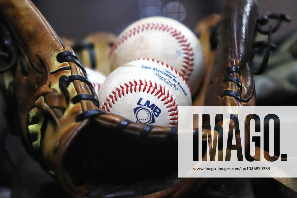 A baseball glove and baseballs are seen during the Mexican Baseball League (LMB) match 1 between Dorados de Chihuahua and Diablos Rojos del Mo xico , at Alfredo Harp Helu Stadium. Diablos Rojos defeat Dorados de Chihuahua 3-1. Mexico City Mexico - ZUMAe321 20240531_zsa_e321_005