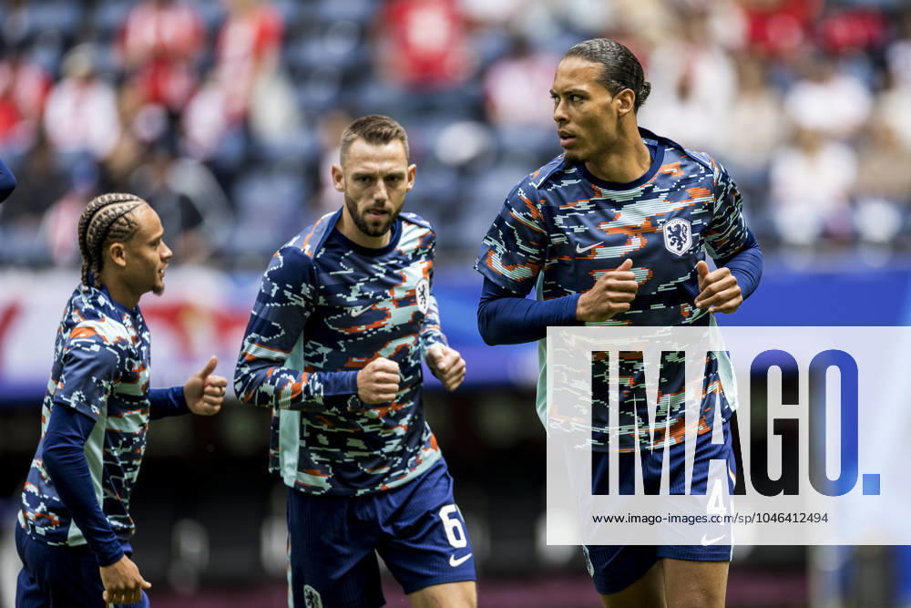 Poland v Netherlands, UEFA EURO, EM, Europameisterschaft,Fussball 2024, Hamburg, Germany Hamburg, Germany. 16th, June 2024. Virgil van Dijk (4) of the Netherlands is warming up before the UEFA Euro 2024 match in Group D between Poland and the Netherlands at Volksparkstadion in Hamburg. Hamburg Germany