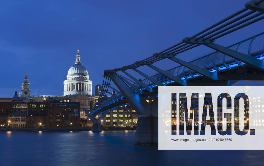 United Kingdom, England, London, View of Millennium Bridge with St Pauls Cathedral in background at night JB000013