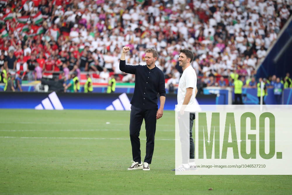 Germany - UEFA EURO, EM, Europameisterschaft,Fussball 2024 - Germany vs Hungary - 19 06 2024 GERMANY, STUTTGART, JUNE 19. Julian Nagelsmann Head Coach of Germany and Benjamin Gluck Assistant Coach of Germany celebrate after their victory at the end the UEFA EURO 2024 group A stage match between Germany and Hungary. On June 19, 2024 at Stuttgart Arena in Stuttgart, Germany. Photo by Manuel Blondeau AOP.Press Stuttgart Stuttgart Arena Germany