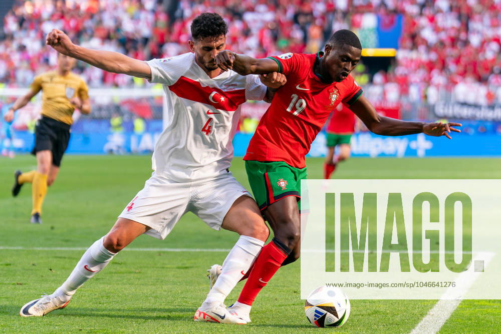 2024-06-22 Turkiye v Portugal - Group F - UEFA EURO, EM, Europameisterschaft,Fussball 2024 DORTMUND, GERMANY - JUNE 22: Samet Akaydin of Turkiye battles for the ball with Nuno Mendes of Portugal during the Group F - UEFA EURO 2024 match between Turkiye and Portugal at BVB Stadion Dortmund on June 22, 2024 in Dortmund, Germany. (Photo by Joris Verwijst BSR Agency) Dortmund Germany Content not available for redistribution in The Netherlands directly or indirectly through any third parties.