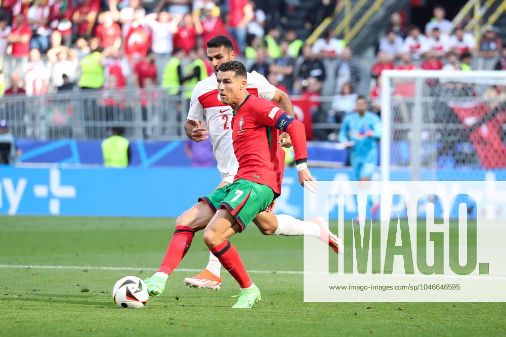 Germany - UEFA EURO, EM, Europameisterschaft,Fussball 2024 - Turkey vs Portugal - 15 06 2024 GERMANY, DORTMUND, JUNE 22. Cristiano Ronaldo of Portugal kicks the ball under pressure from Zeki Celik of Turkey during the UEFA EURO 2024 group F stage match between Turkey and Portugal, on June 22, 2024 at BVB Stadion in Dortmund, Germany. Photo by Manuel Blondeau AOP.Press Dortmund BVB Stadion Germany